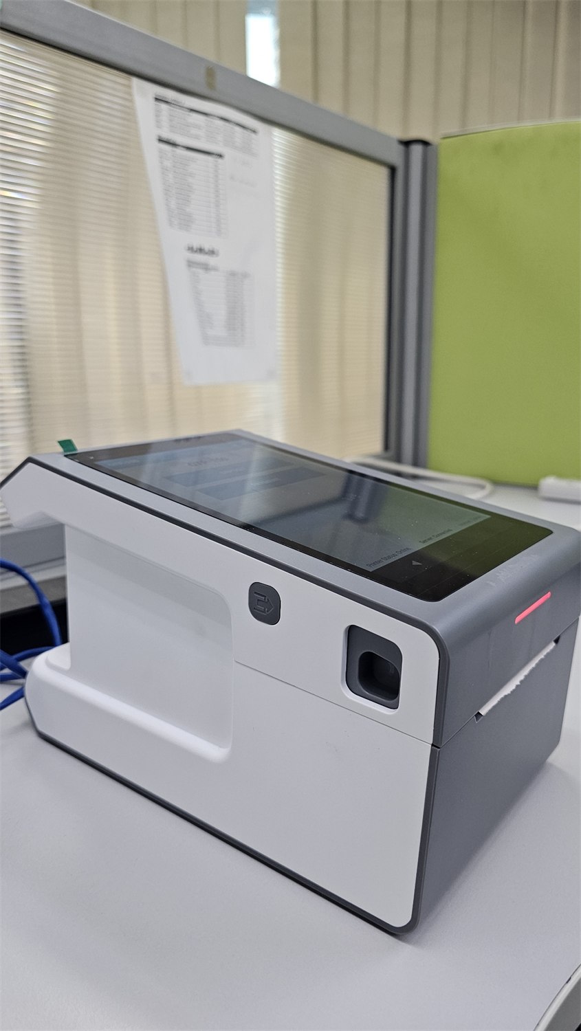 QTP-150 queue ticket printer installed and running at a service counter